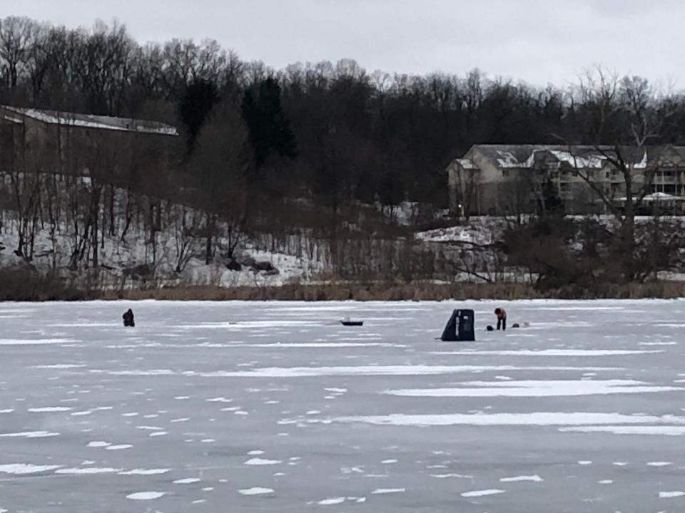 Anglers, including someone in a shanty, fish on Stone Lake in Cassopolis on Monday evening.