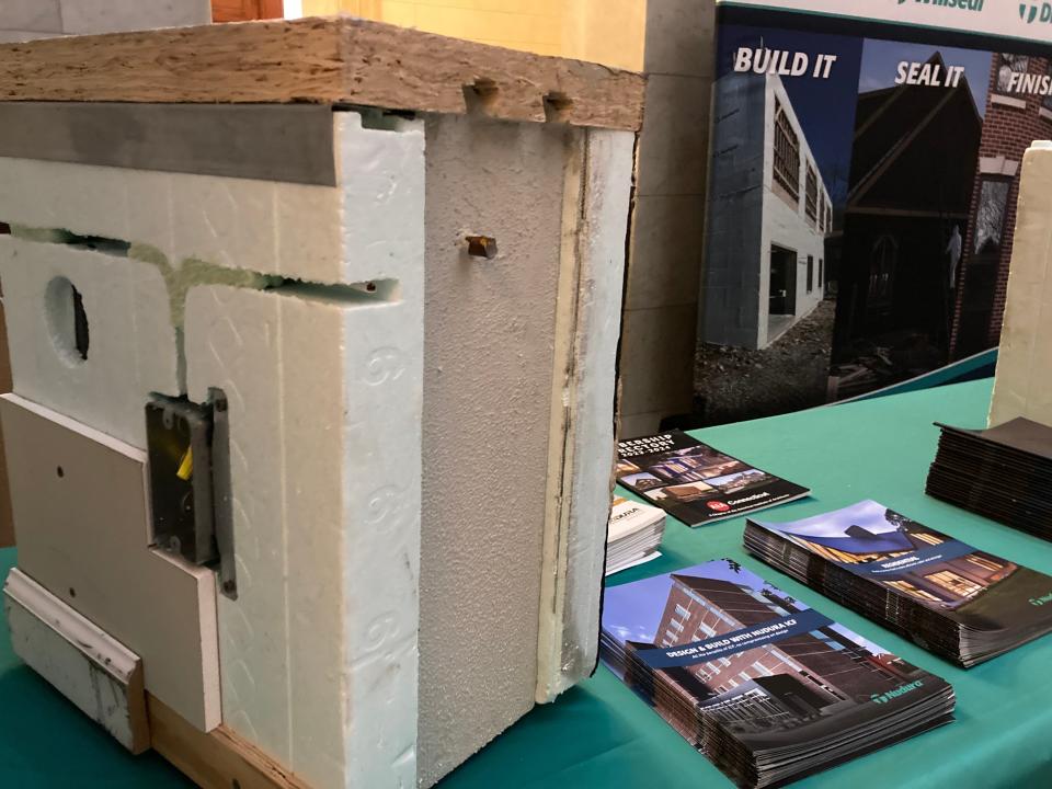 Concrete and rebar are sandwiched between inside facing walls and outer walls in a demonstration wall model set up in Nurses Hall in the Massachusetts Statehouse by concrete industry representatives Wednesday.