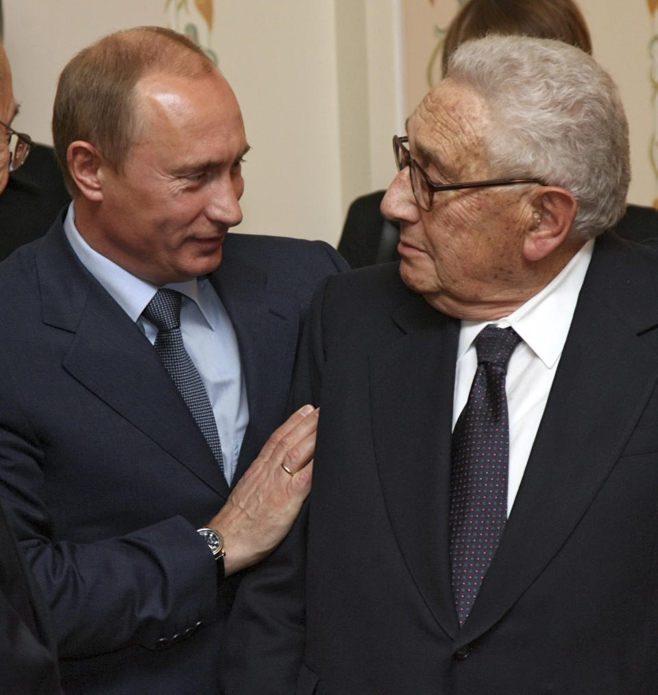 FILE - Russian President Vladimir Putin, left, greets former U.S. Secretary of State Henry Kissinger during a meeting in the Novo-Ogaryovo residence outside Moscow, July 13, 2007. Kissinger, the diplomat with the thick glasses and gravelly voice who dominated foreign policy as the United States extricated itself from Vietnam and broke down barriers with China, died Wednesday, Nov. 29, 2023. He was 100. (AP Photo/Sergei Chirikov, Pool, File)