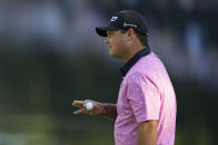 Patrick Reed waves after his putt on the 16th hole during the final round of the Masters golf tournament at Augusta National Golf Club on Sunday, April 9, 2023, in Augusta, Ga. (AP Photo/Charlie Riedel)