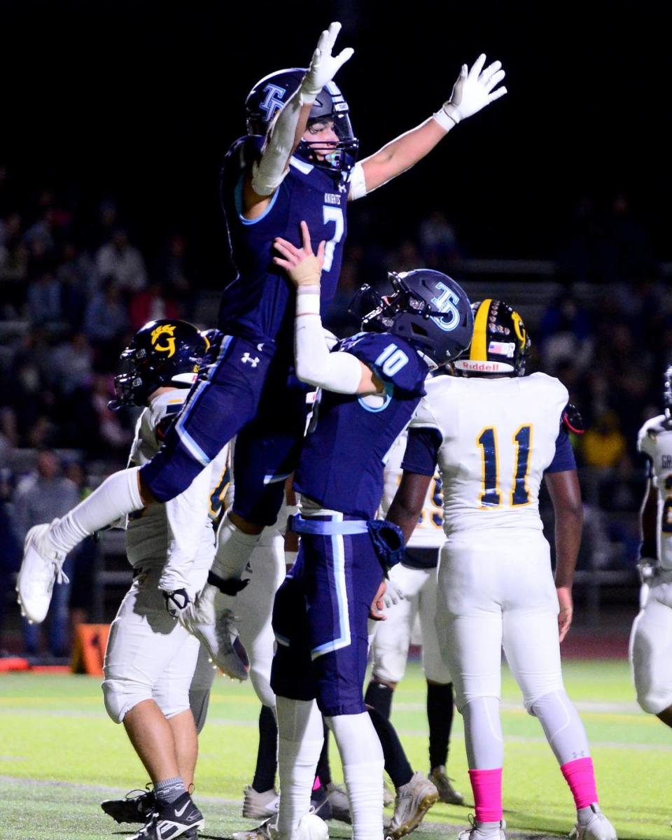 Downey running back Elijah Tamayo (7) celebrates with Carson Lamb (10) after scoring a touchdown during a game between Downey and Gregori at Downey High School in Modesto, California on October 27, 2023.