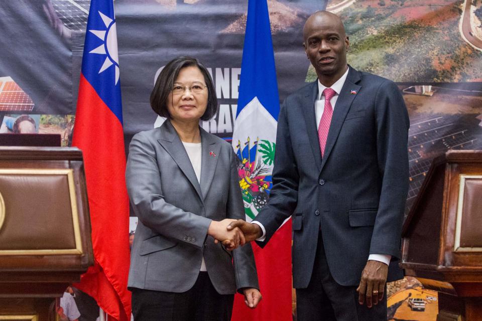 Taiwan's President Tsai Ing-wen and Haiti's President Jovenel Moise shake hands during a state visit in Port-au-Prince on July 13, 2019. - Taiwan President Tsai Ing-wen's choice of Port-au-Prince as the first stop in her Caribbean tour is highly symbolic of the diplomatic power struggle being played out in the region. Last year, the neighboring Dominican Republic dropped Taipei and threw in its diplomatic lot with Beijing, leaving Haiti as one of only 17 countries still officially recognizing Taiwan as a country. (Photo by Pierre Michel JEAN / AFP)        (Photo credit should read PIERRE MICHEL JEAN/AFP/Getty Images)