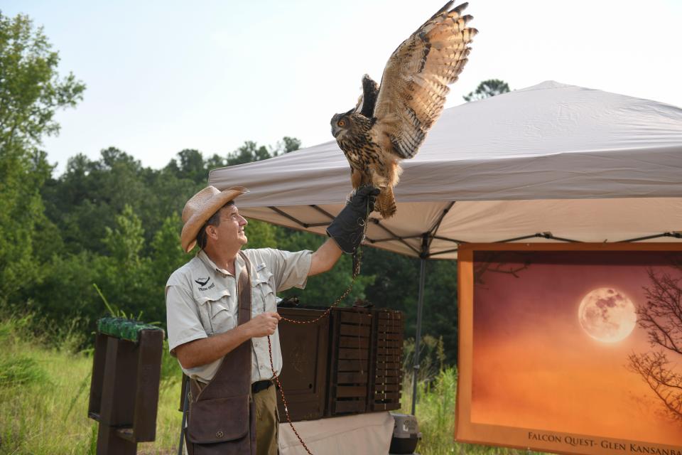 Founder of Falcon Quest Glen Kansanback holds Boo the Eurasian eagle-owl during a demonstration off Madeline Drive in Augusta, Ga., on Monday, July 17, 2023. 