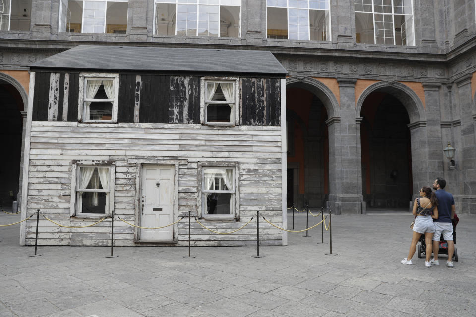 The house of U.S. civil rights campaigner Rosa Parks, rebuilt by artist Ryan Mendoza, is on display in the courtyard of an 18th century Royal Palace, in Naples, Italy, Tuesday, Sept. 15, 2020. It’s the latest stop for the house in a years-long saga that began when Parks’ niece saved the tiny two-story home from demolition in Detroit after the 2008 financial crisis. (AP Photo/Gregorio Borgia)