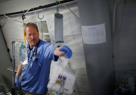 A foreign volunteer works at the emergency field hospital which is run by the US Christian charity Samaritan's Purse, eastern Mosul, Iraq March 22, 2017. Picture taken March 22, 2017. REUTERS/Suhaib Salem