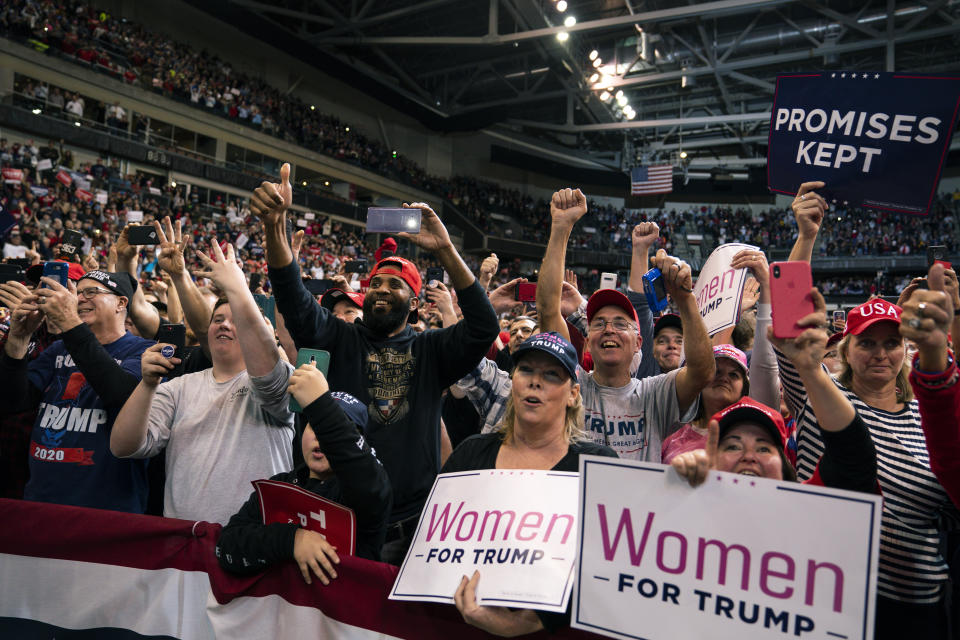 Supporters of President Donald Trump cheer as he arrives at SNHU Arena to speak during a campaign rally, Monday, Feb. 10, 2020, in Manchester, N.H. (AP Photo/Evan Vucci)