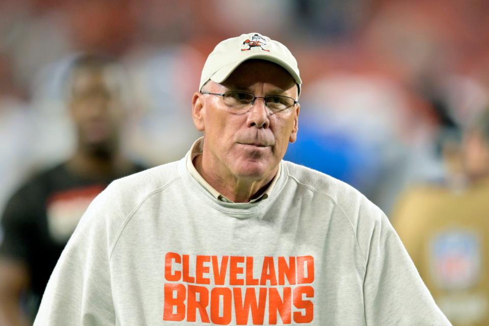 Browns general manager John Dorsey walks on the field after a preseason game against the Detroit Lions, Aug. 29, 2019, in Cleveland.