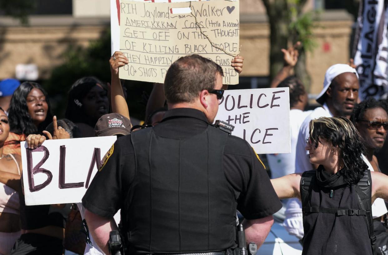 Demonstrators stand off with officers July 3, 2022, in Akron, Ohio, as they protest the killing of Jayland Walker, shot by police. <a href="https://www.gettyimages.com/detail/news-photo/demonstrators-standoff-with-akron-sheriffs-officers-outside-news-photo/1241690704?adppopup=true" rel="nofollow noopener" target="_blank" data-ylk="slk:Matthew Hatcher/AFP via Getty Images;elm:context_link;itc:0;sec:content-canvas" class="link ">Matthew Hatcher/AFP via Getty Images</a>
