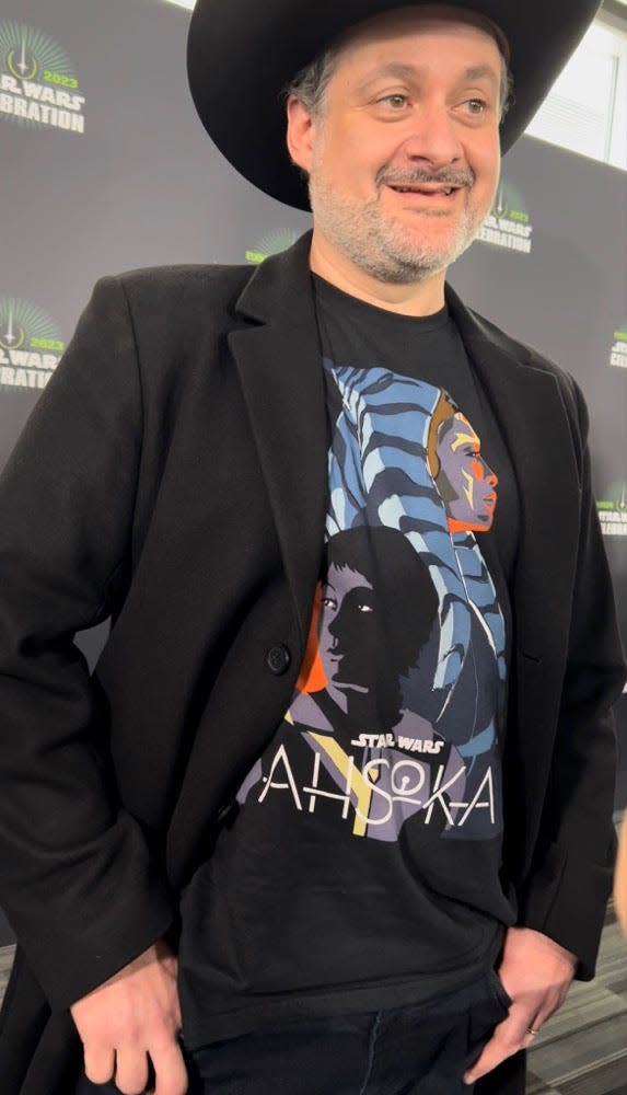 'Star Wars' writer Dave Filoni appears (in an "Ahsoka" shirt) at the fan celebration in London.