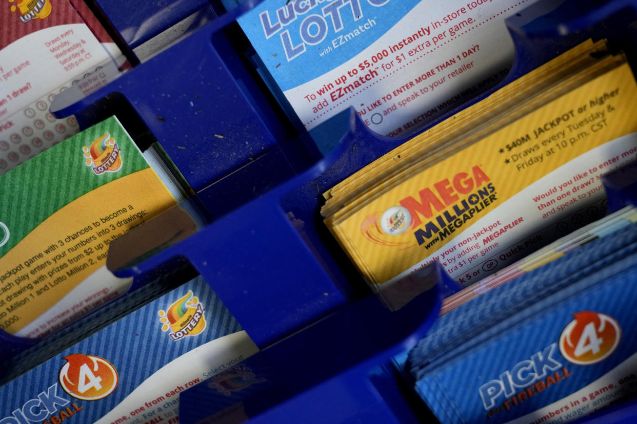 Lottery tickets included Mega Millions are placed on the counter at a convenience store Tuesday, Jan. 3, 2023, in Northbrook, Ill. (AP Photo/Nam Y. Huh)