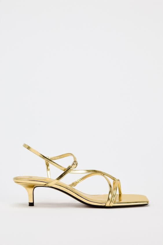 <p><a href="https://go.redirectingat.com?id=74968X1596630&url=https%3A%2F%2Fwww.zara.com%2Fus%2Fen%2Fkitten-heel-metallic-sandals-p11312410.html&sref=https%3A%2F%2Fwww.cosmopolitan.com%2Fstyle-beauty%2Ffashion%2Fa61559580%2Fshoes-to-wear-with-dresses%2F" rel="nofollow noopener" target="_blank" data-ylk="slk:Shop Now;elm:context_link;itc:0;sec:content-canvas" class="link rapid-noclick-resp">Shop Now</a></p><p>Kitten Heel Metallic Sandals </p><p>zara.com</p><p>$49.90</p>