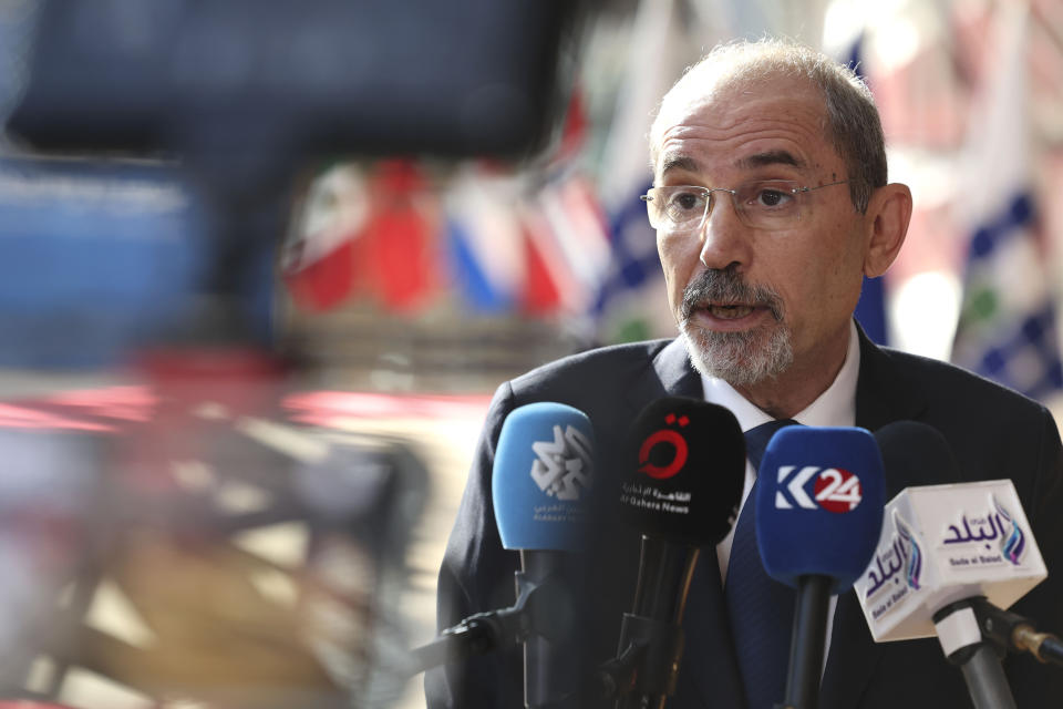 Jordan's Minister for Foreign Affairs Ayman Safadi speaks with the media as he arrives for a meeting 'Supporting the future of Syria and the region' at the European Council building in Brussels, Thursday, June 15, 2023. Aid agencies will struggle to draw the world's attention back to Syria at an annual donor conference hosted by the European Union in Brussels for humanitarian aid to Syrians. (AP Photo/Geert Vanden Wijngaert)