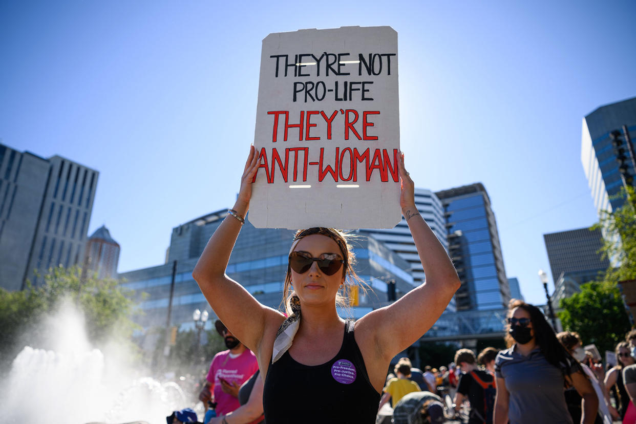 People gather to protest the Supreme Court