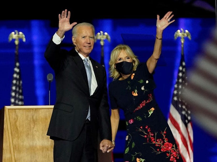 President-elect Joe Biden and Jill Biden wave after Biden's victory speech.