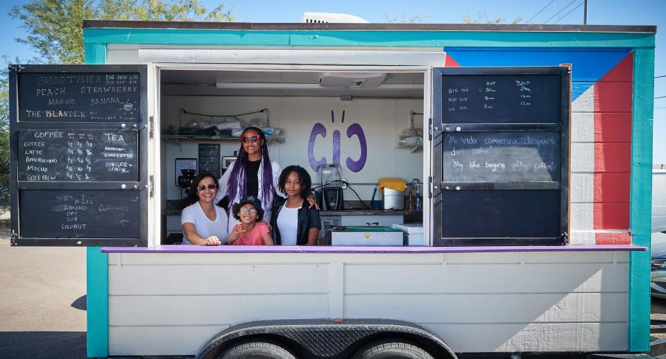 Aida Villegas (from left) and her daughters, Catalina, 20, Carolyn, 10, and Imena, 16, pose for a portrait in their trailer at Cicter's Cafe in Buckeye.