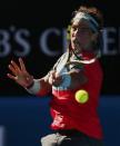 Rafael Nadal of Spain hits a return to Grigor Dimitrov of Bulgaria during their men's singles quarter-final tennis match at the Australian Open 2014 tennis tournament in Melbourne January 22, 2014. REUTERS/Petar Kujundzic