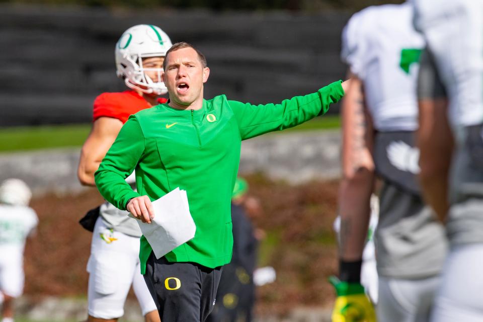 Oregon offensive coordinator Kenny Dillingham calls out to players during practice with the Ducks on Tuesday, April 5, 2022.