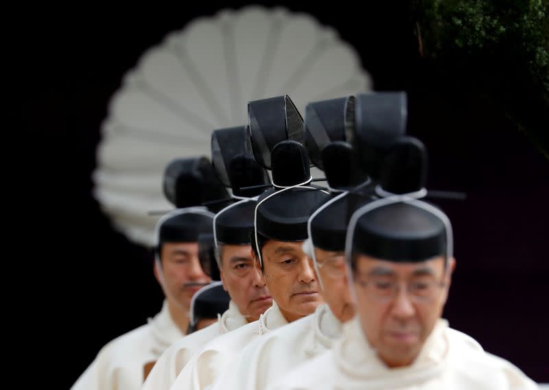 FILE PHOTO: Japanese Shinto priests attend a ritual during an autumn festival at Yasukuni Shrine in Tokyo