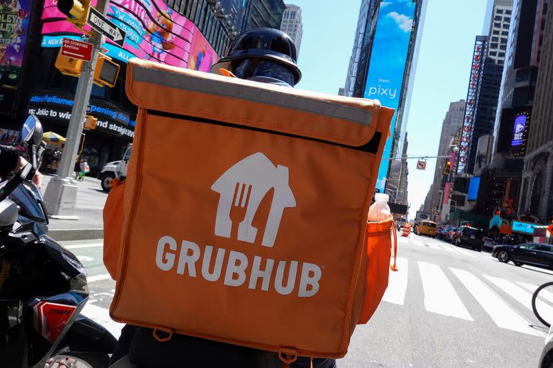 FILE PHOTO: A Grubhub delivery person rides in Manhattan, New York City