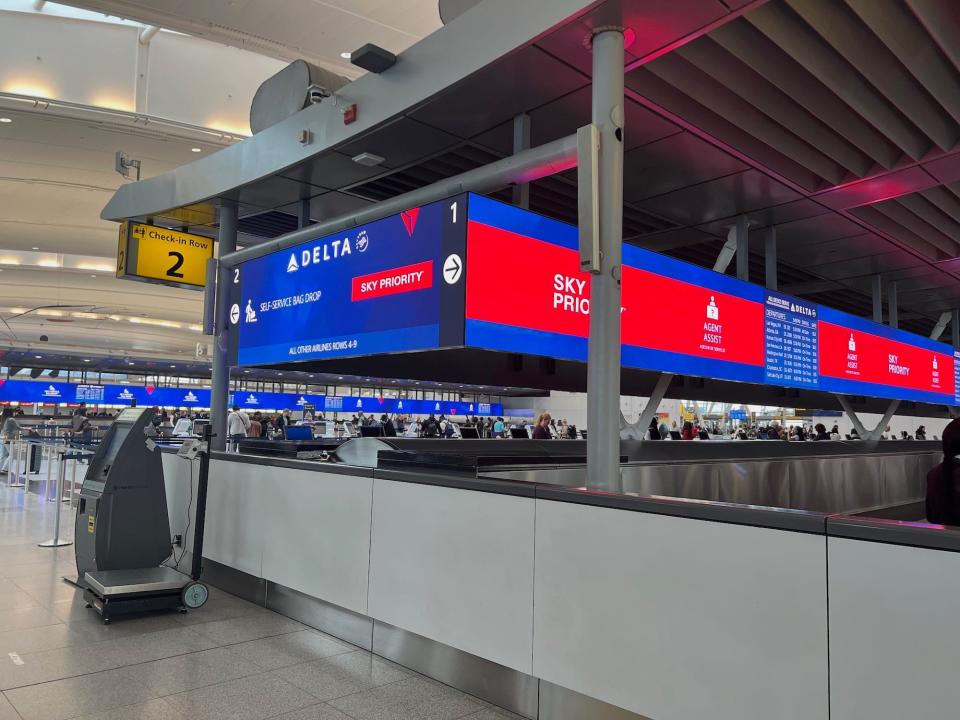 The dedicated Sky Priority lane with red sign.