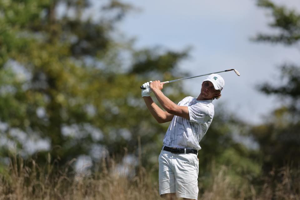 Michigan State senior golfer August Meekhof hits a shot during the final round of the Folds of Honor Collegiate at American Dunes Golf Club in Grand Haven, Mich. MSU finished second in the event and Meekhof finished tied for sixth individually.