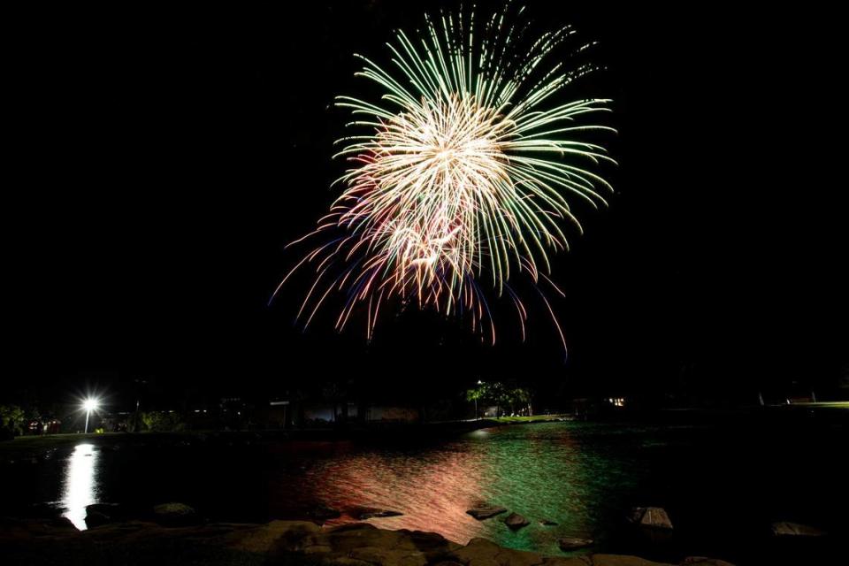 Fireworks light up the sky over the lake at Barney Schwartz Park in Paso Robles on Tuesday, July 4, 2023.