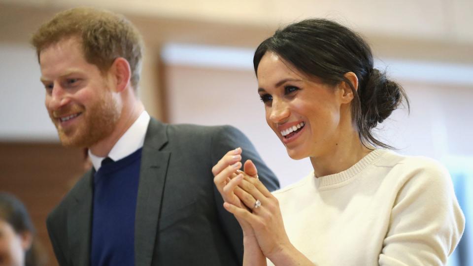 Prince Harry and Meghan smiling