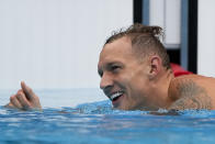 Caeleb Dressel, of United States, celebrates wining a men's 50-meter freestyle heat at the 2020 Summer Olympics, Friday, July 30, 2021, in Tokyo, Japan. (AP Photo/Gregory Bull)