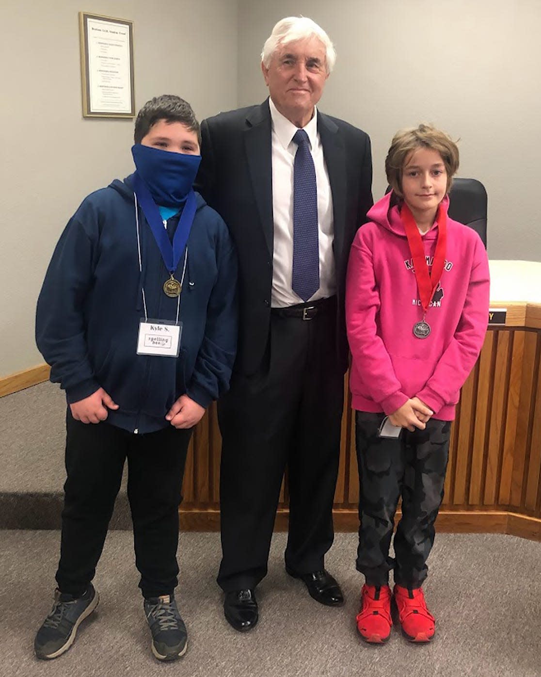 B. McDaniel 2022 Spelling Bee Champion Kyle Shearin and runner-up William Burleson are presented their medals by Denison ISD Superintendent Dr. Henry Scott. The win qualified Shearin to compete at the upcoming Grayson County Spelling Bee in February.