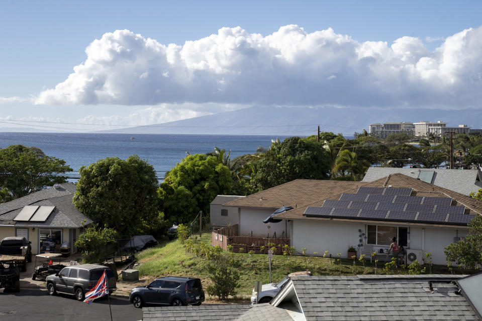 Homes on Wahinoho Way in the Villages of Leiali'i, a neighborhood in the Hawaiian home lands, on Monday, Sept. 25, 2023, in Lahaina, Hawaii. The houses in the neighborhood mostly survived a deadly August fire. (AP Photo/Mengshin Lin)