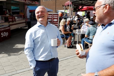 Conservative MP Royston Smith talks to members of the public in a shopping precinct in his constituency of Southampton Itchen