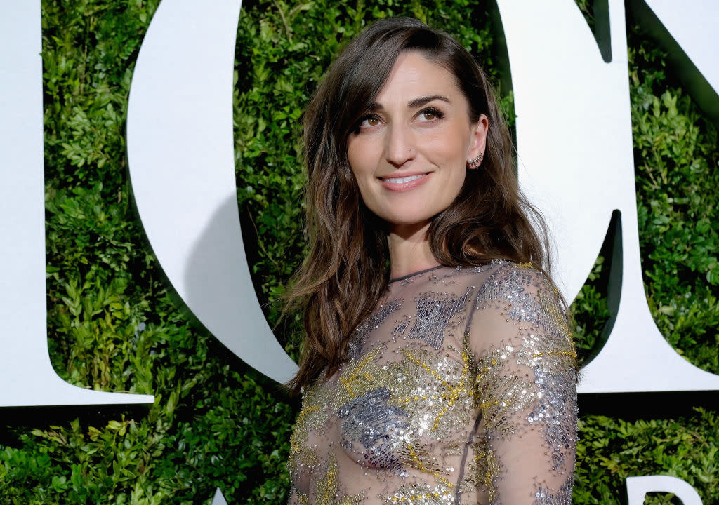 Sara Bareilles looks like a high fashion bumblebee in this black and yellow striped dress