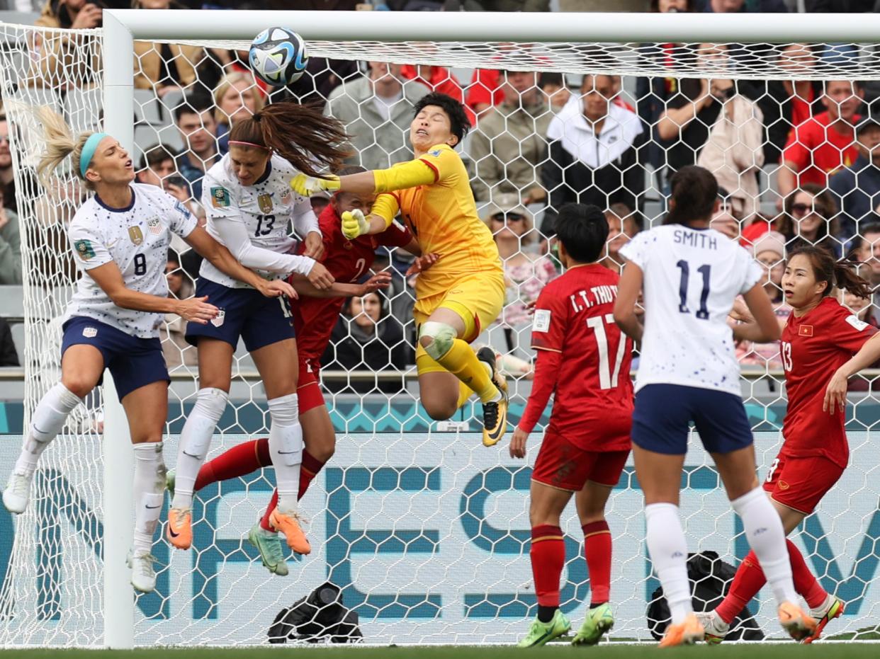 Julie Ertz, left, participates in a brawl for the ball during the USA’s Women’s World Cup match against Vietnam on 22 July 2023 (AP Photo/Rafaela Pontes)