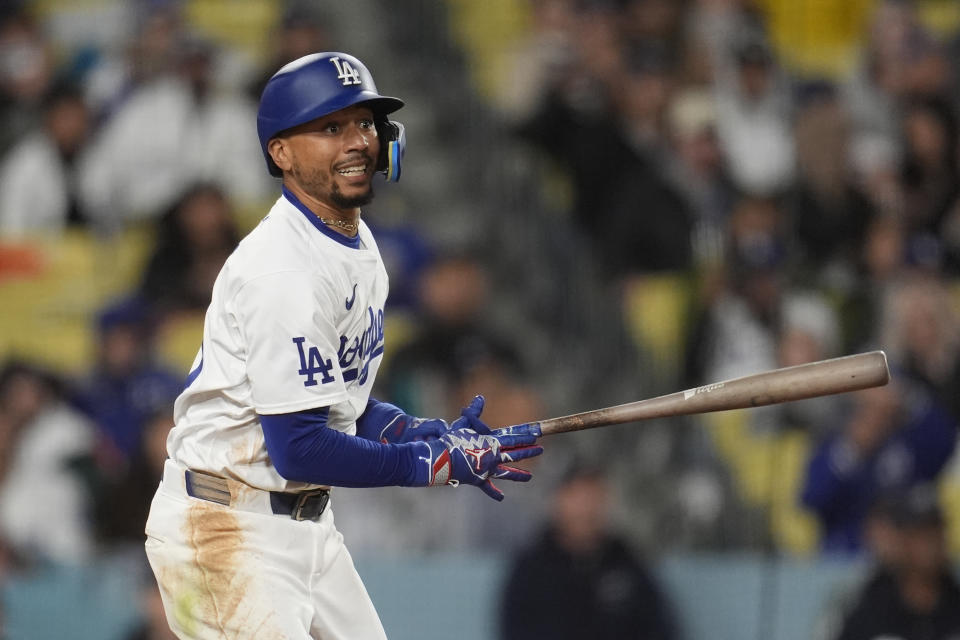 Los Angeles Dodgers' Mookie Betts follows his RBI single during the sixth inning of a baseball game against the San Diego Padres, Saturday, April 13, 2024, in Los Angeles. (AP Photo/Marcio Jose Sanchez)