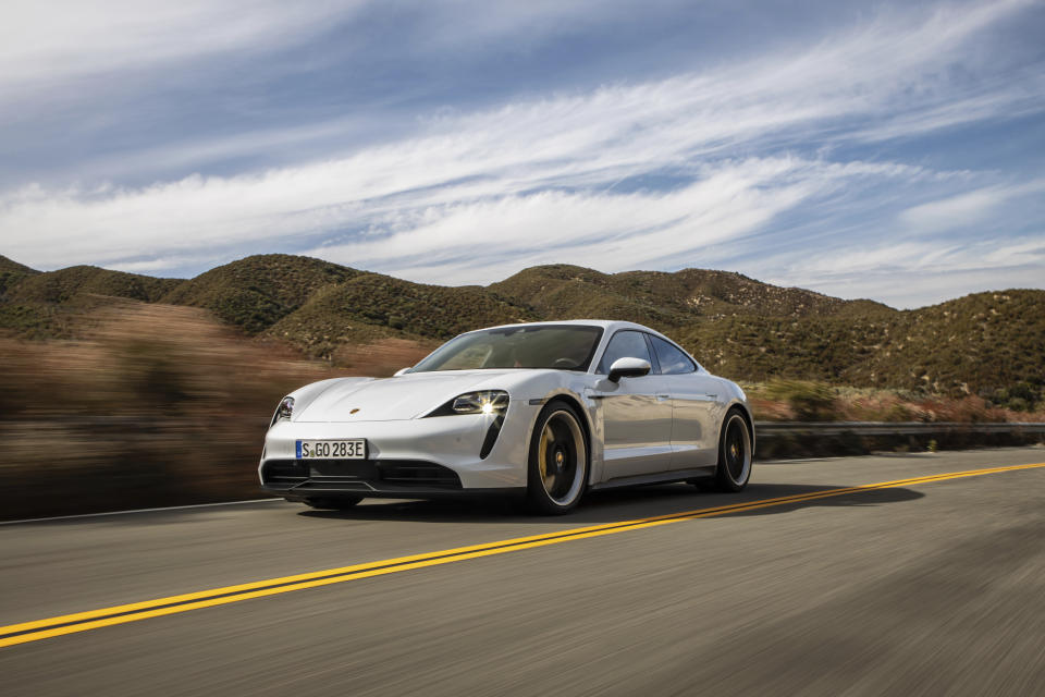 This photo provided by Porsche shows the 2020 Porsche Taycan, a premium electric sedan with an estimated range of 227 miles. Edmunds has noted that this car is capable of getting more range in real-world conditions. (Courtesy of Porsche Cars North America via AP)