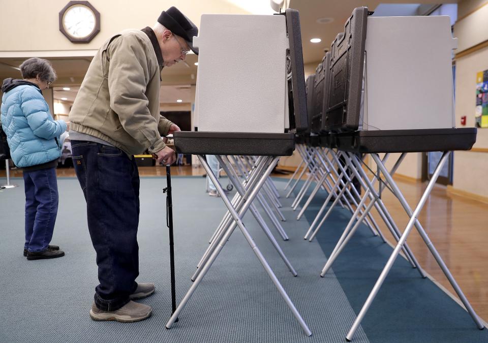 Stanley Sielaff and Sharon Sielaff vote Tuesday at the Grand Chute Town Hall.