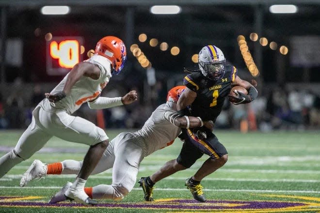 Calvary Day sophomore Doopah Coleman fights for yardage in a win over Johnson High on Oct. 14.