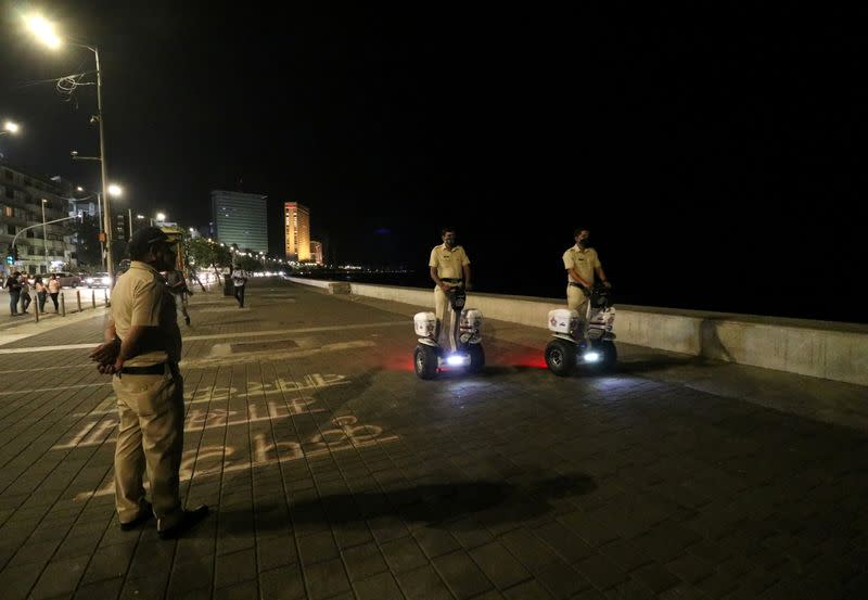 FILE PHOTO: Police officers patrol on Segways along the promenade at Marine Drive during a curfew to limit the spread of the coronavirus disease (COVID-19), in Mumbai
