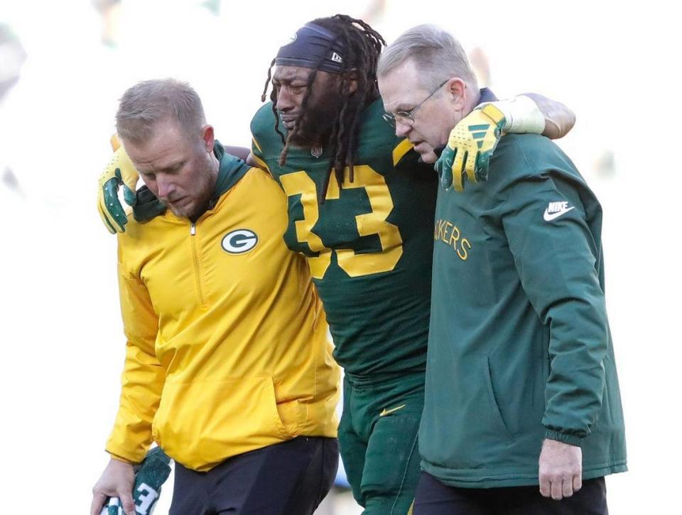 Syndication: The Post-Crescent. Green Bay Packers running back Aaron Jones (33) is helped off the field after getting injured in the second quarter againsst the Los Angeles Chargers during their football game Sunday, November 19, 2023, at Lambeau Field in Green Bay, Wis. Dan Powers/USA TODAY NETWORK-Wisconsin / USA TODAY NETWORK