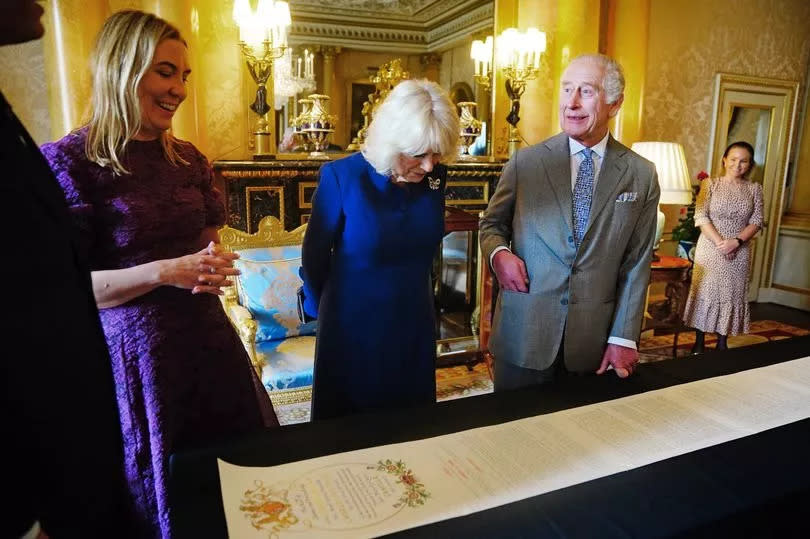 Charles and Camilla were presented with the roll at a special event