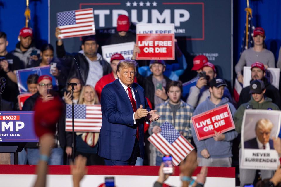 DURHAM, NEW HAMPSHIRE - DECEMBER 16: Republican presidential candidate, former U.S. President Donald Trump claps during a campaign event at the Whittemore Center Arena on December 16, 2023 in Durham, New Hampshire. Trump is campaigning ahead of the New Hampshire primary on January 23. (Photo by Scott Eisen/Getty Images)