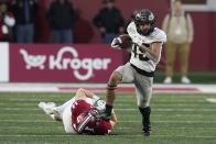 Purdue's Devin Mockobee (45) runs from Indiana linebacker Kaiden Turner (14) during the second half of an NCAA college football game, Saturday, Nov. 26, 2022, in Bloomington, Ind. (AP Photo/Darron Cummings)