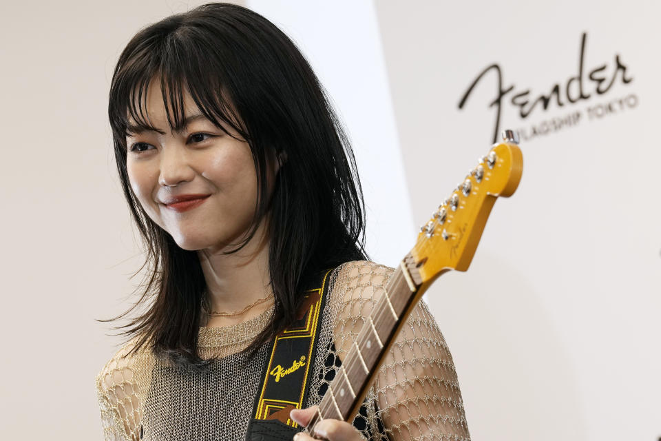 Erino Yumiki, a Japanese guitarist and songwriter, attends the opening ceremony of Fender's Tokyo store Thursday, June 29, 2023. Fender, the guitar of choice for some of the world’s biggest stars from Jimi Hendrix to Eric Clapton, is opening what it calls its “first flagship store” in its 77-year history. (AP Photo/Eugene Hoshiko)