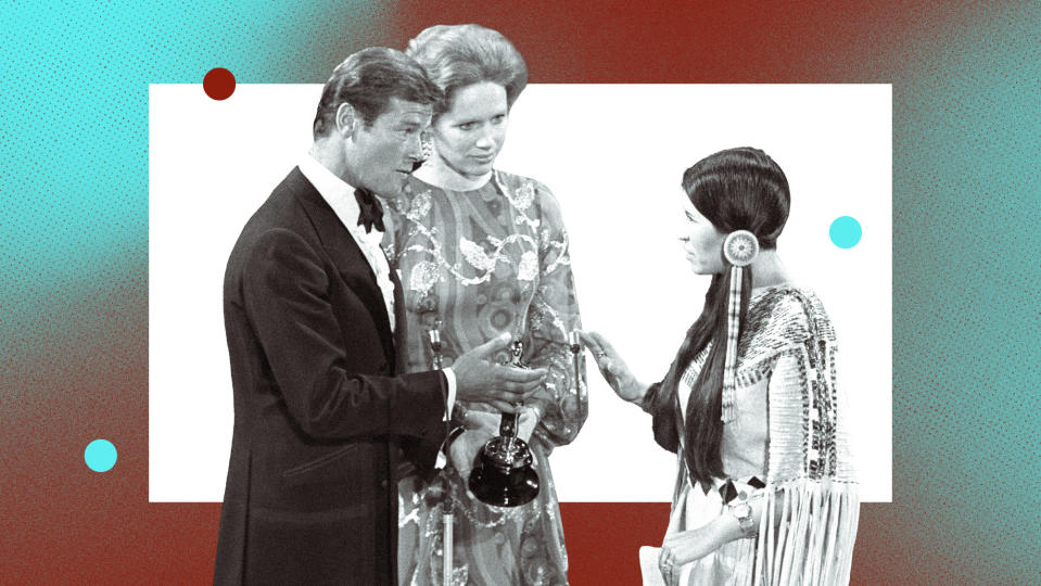 Sacheen Littlefeather (far right) with Oscar presenters Roger Moore and Liv Ullmann at the 45th annual Academy Awards in 1973.