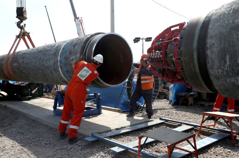 FILE PHOTO: Workers are seen at the construction site of the Nord Stream 2 gas pipeline, near the city of Kingisepp, Russia