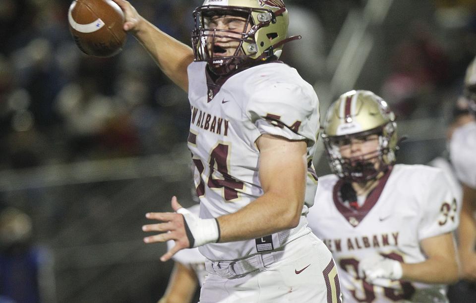 New Albany's Tom Bohman celebrates after recovering a fumble by Gahanna on a punt return during their game at Whitehall on Sept. 30.