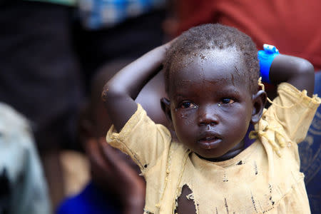 A child displaced by fighting in South Sudan arrives in Lamwo after fleeing fighting in Pajok town across the border in northern Uganda April 5, 2017. REUTERS/James Akena
