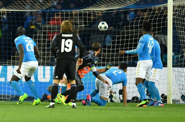 Real Madrid's defender Sergio Ramos (C) scores a second goal during the UEFA Champions League football match SSC Napoli vs Real Madrid on March 7, 2017 at the San Paolo stadium in Naples