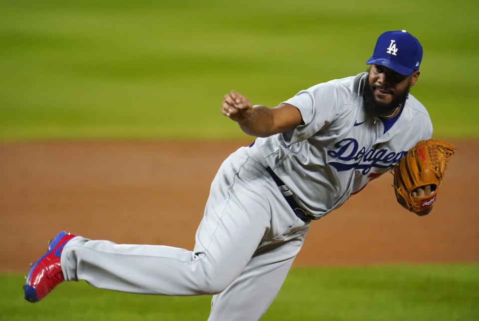 Los Angeles Dodgers relief pitcher Kenley Jansen works against the Colorado Rockies during the ninth inning of a baseball game Saturday, Sept. 19, 2020, in Denver. The Dodgers won 6-1. (AP Photo/David Zalubowski)