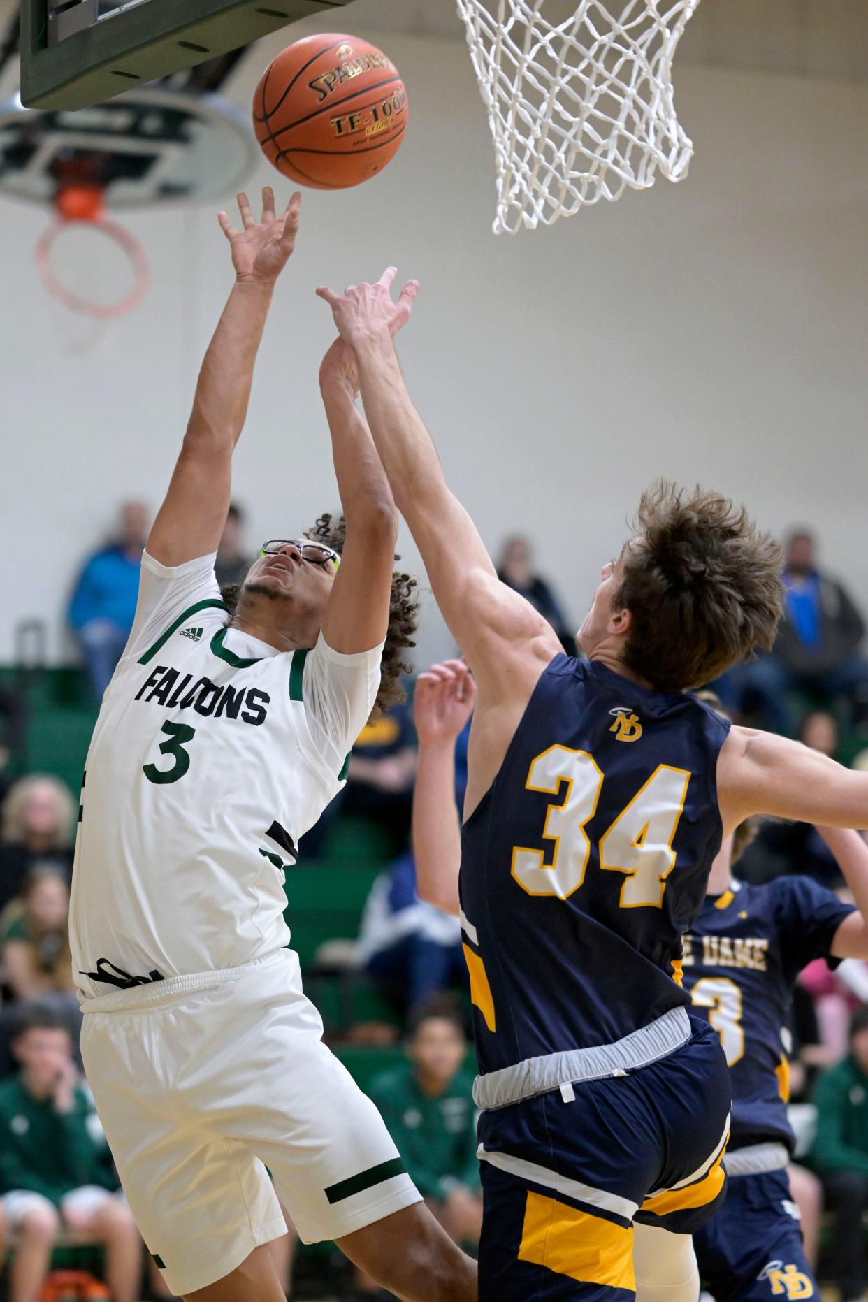 West Burlington's Jace Figuereo (3) puts up a shot against Notre Dame's Ethan Todd Tuesday at West Burlington.